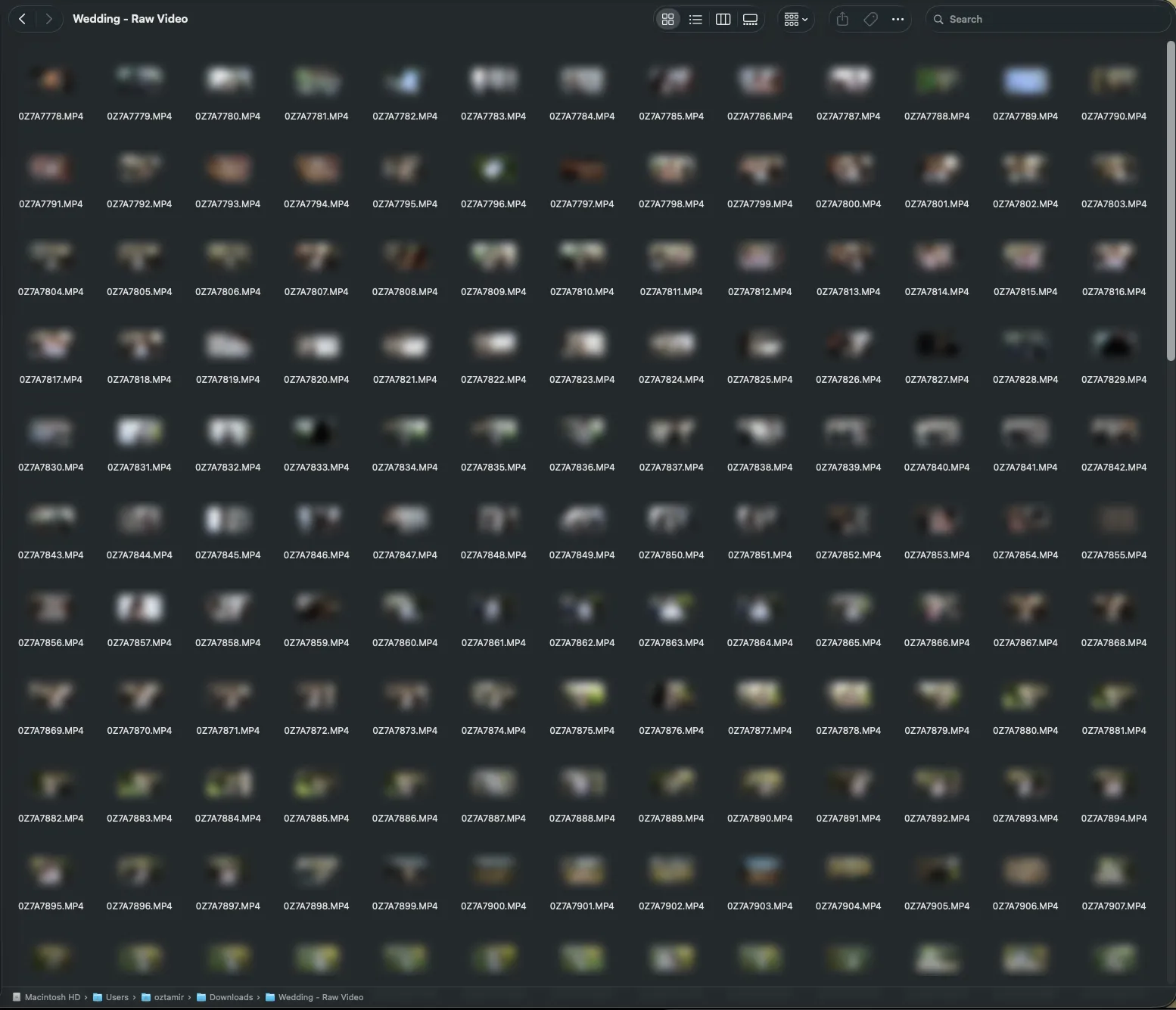 Finder showing the raw wedding footage as a grid of identical thumbnails
